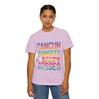 Person wearing a pink t-shirt with colorful text on a white background