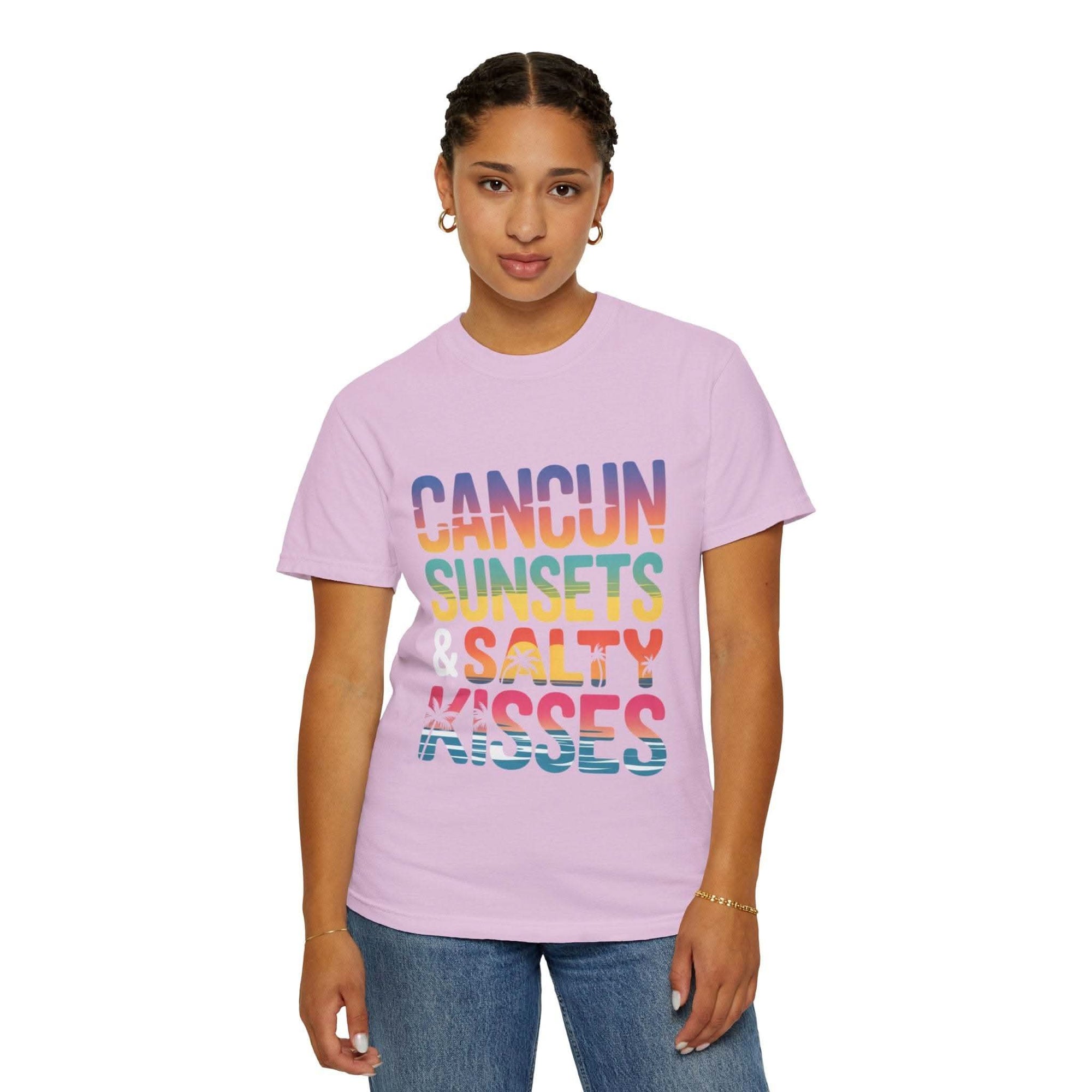 Person wearing a pink t-shirt with colorful text on a white background