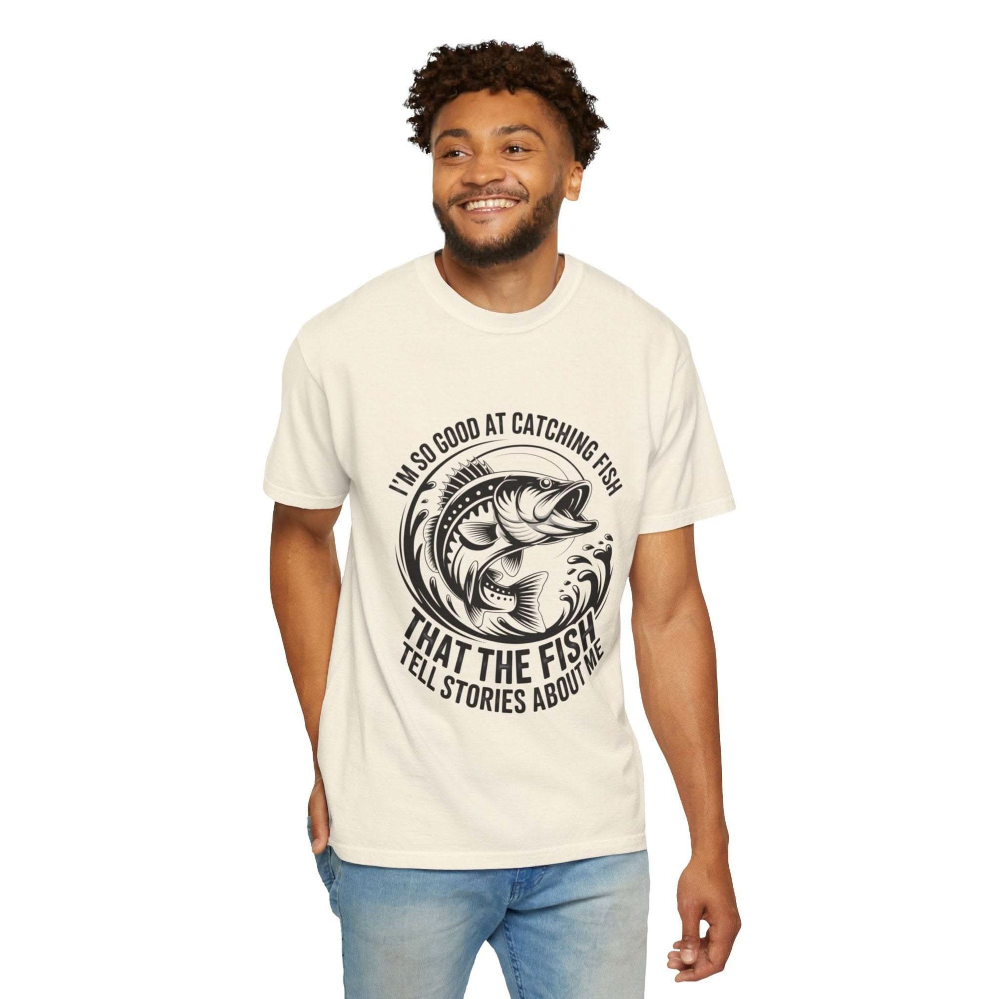 Fishing T-shirt with humorous "So Good At Catching Fish That The Fish Tell Stories About Me" text, soft cotton, relaxed fit for anglers