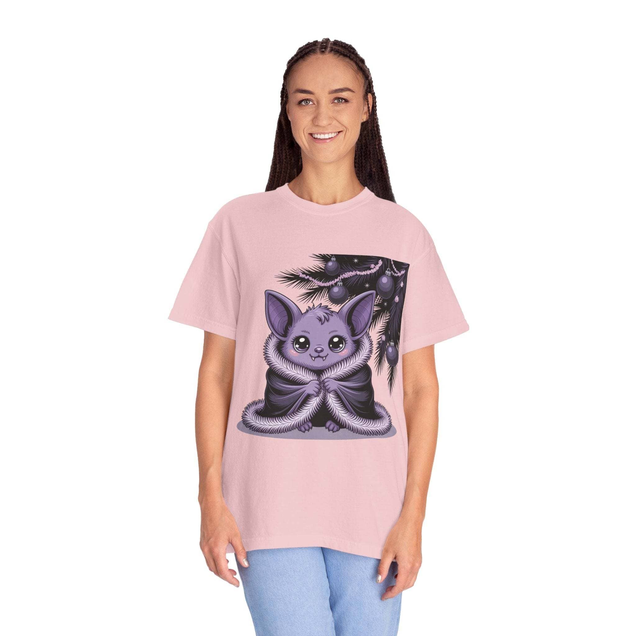 Person wearing a pink t-shirt with a cartoon character design on a white background