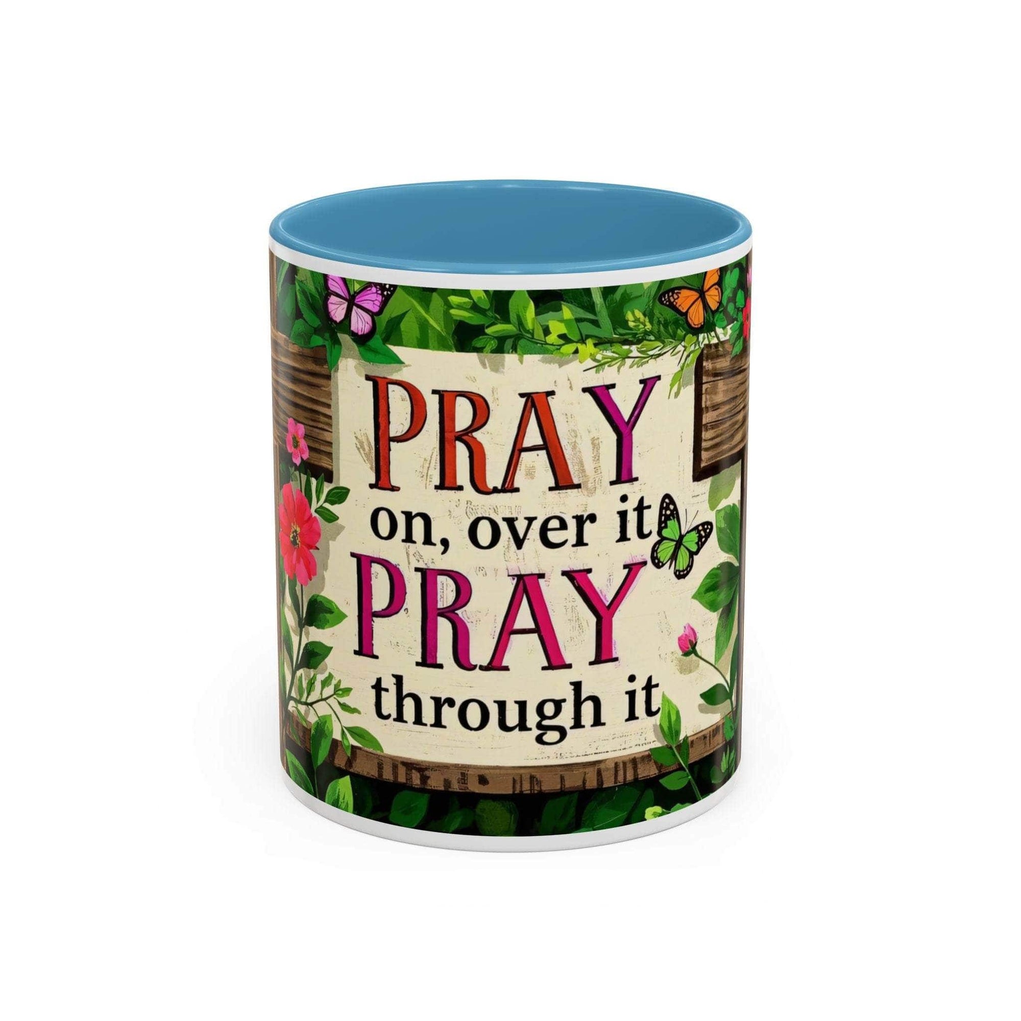 Mug with motivational quote 'Pray on, over it. Pray through it.' and floral design.