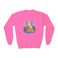 Pink sweatshirt with a cartoon axolotl and dog design on a white background