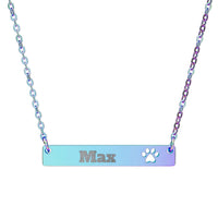 Necklace with a bar pendant engraved with 'Max' and a paw print on a white background