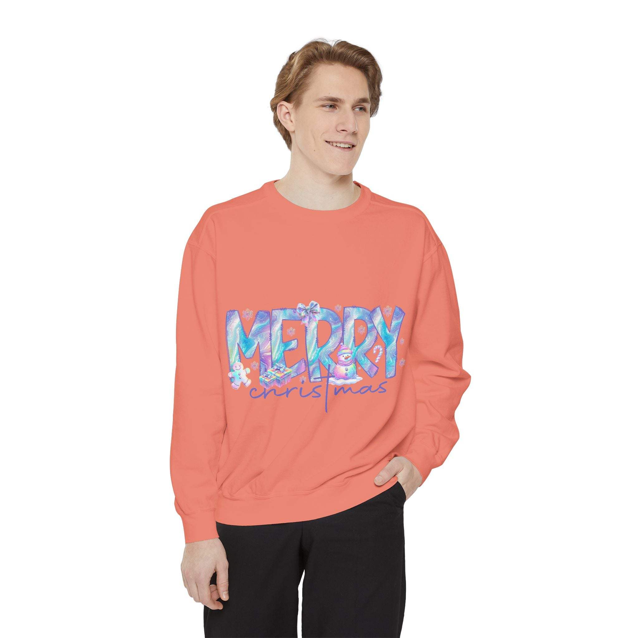 young man wearing coral iridescent Merry Christmas sweatshirt with relaxed fit and ribbed cuffs