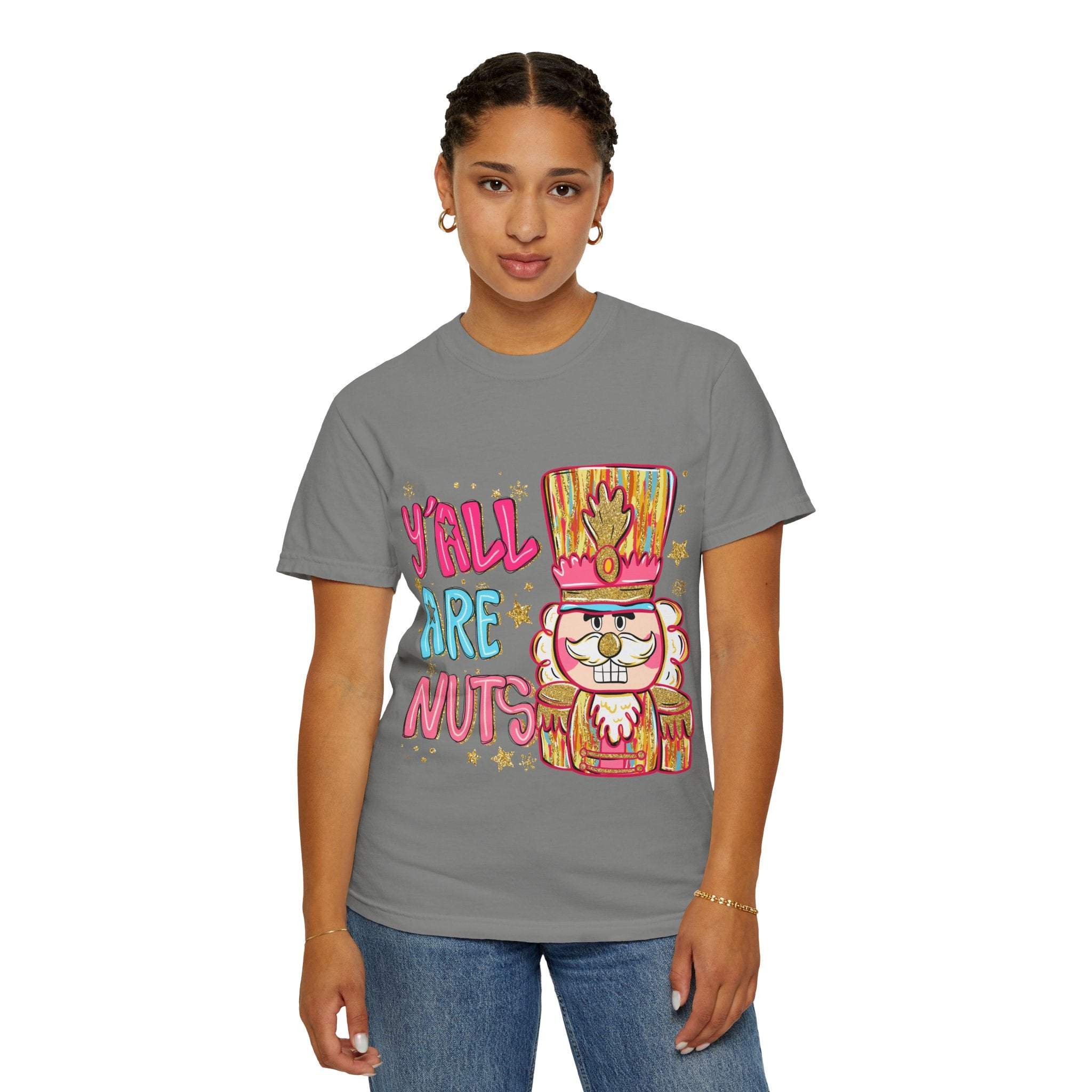 woman wearing gray Yall Are Nuts Nutcracker graphic t-shirt with colorful nutcracker design and text