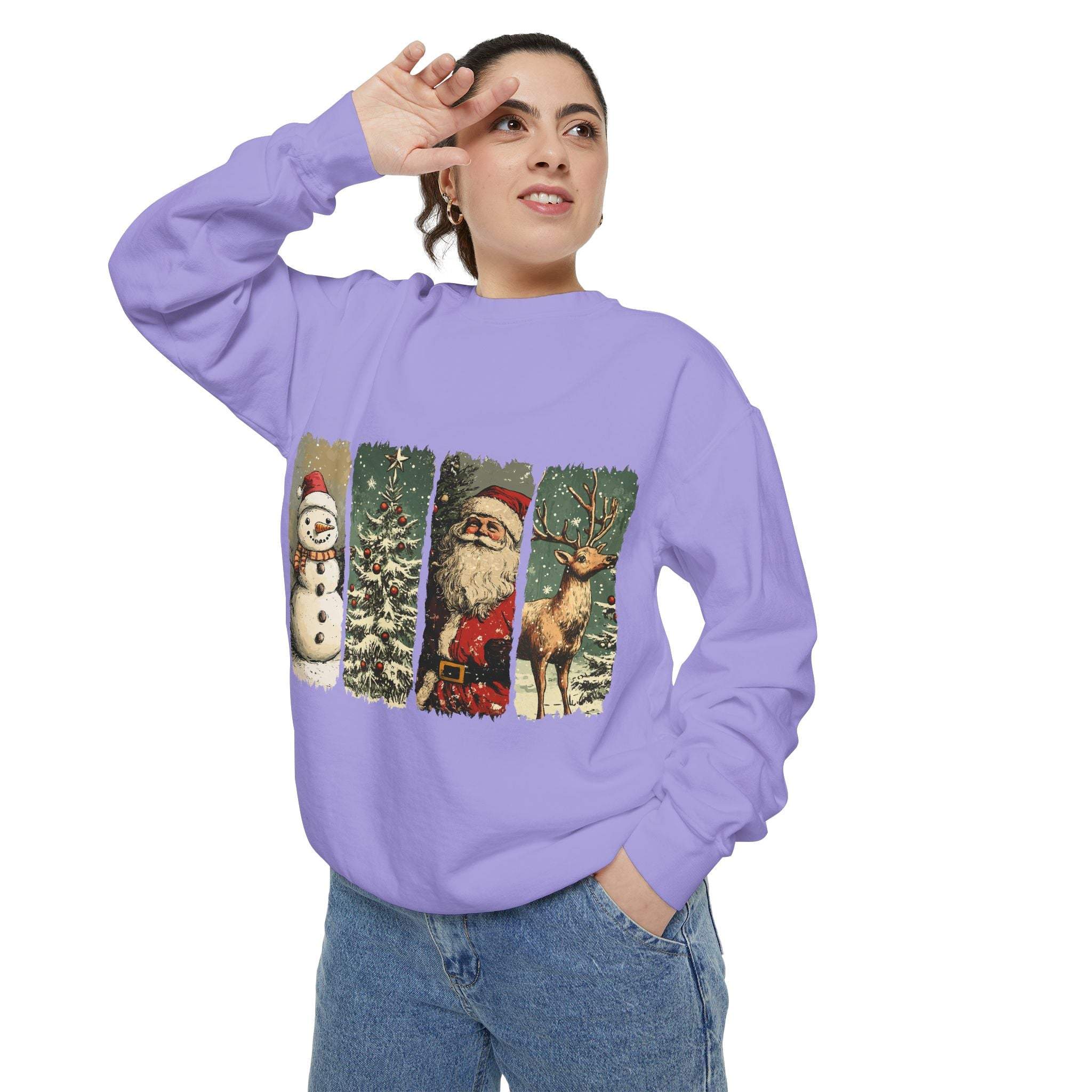 Woman wearing vintage Christmas sweatshirt with watercolor swatches of snowman, Christmas tree, Santa, and reindeer on purple fabric