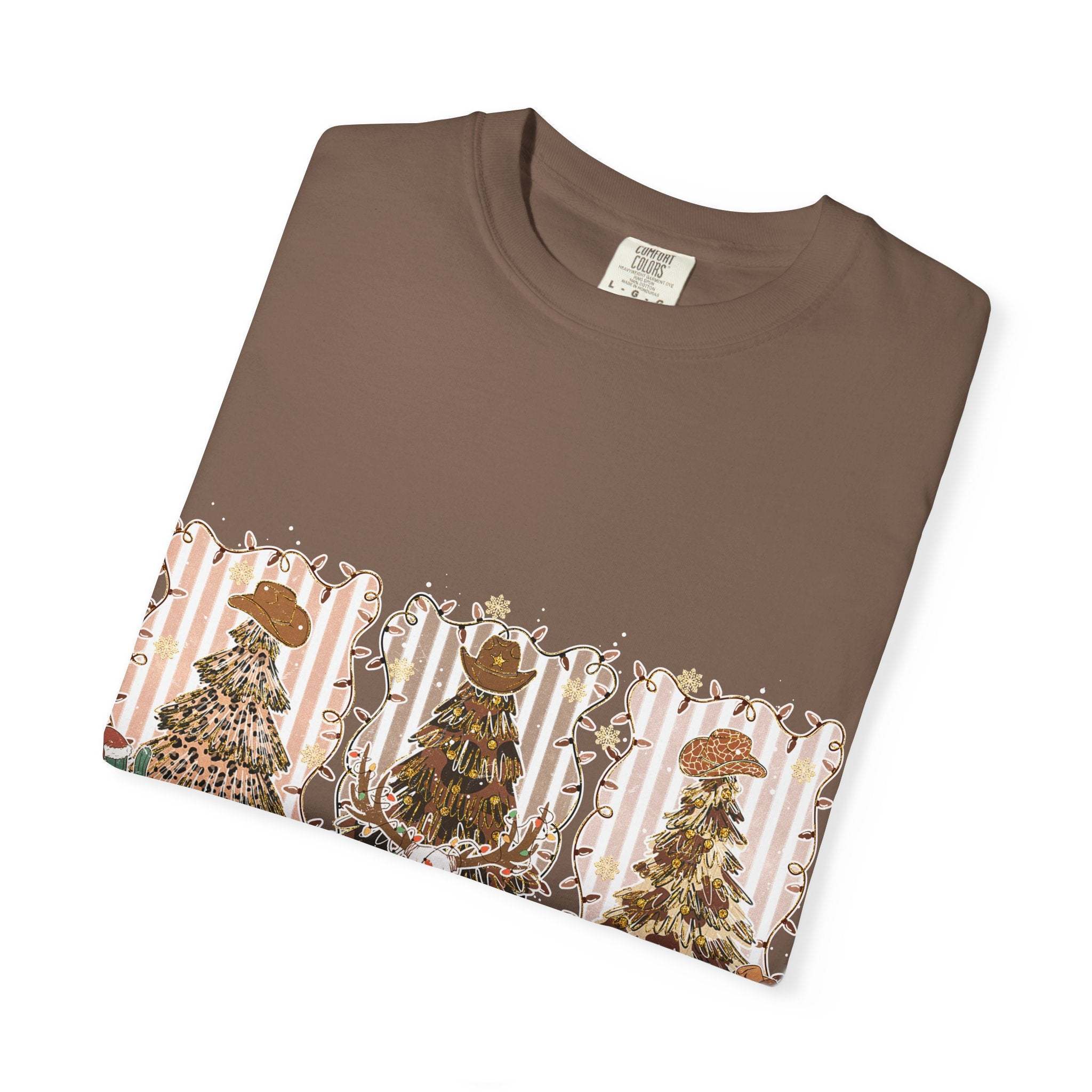 Folded brown Cowboy Howdy Christmas t-shirt with festive cowboy-themed tree design