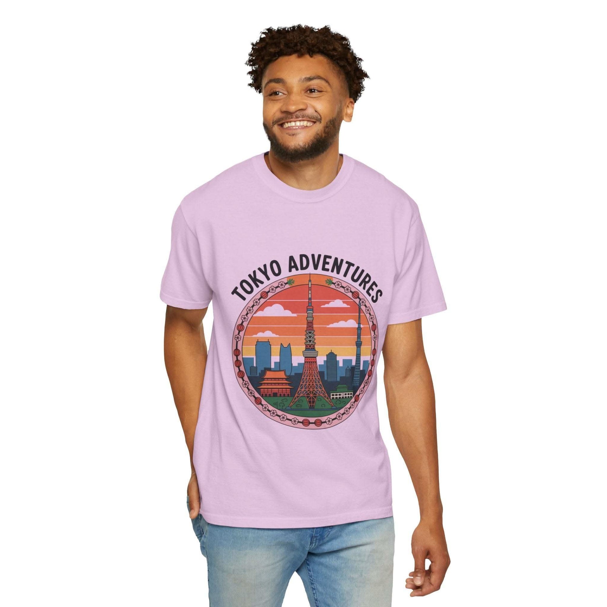 Man wearing light purple garment-dyed T-shirt with Tokyo Adventures travel graphic and cityscape illustration