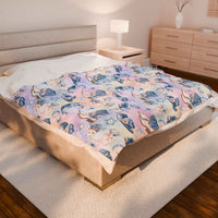 Coastal Cowgirl design plush blanket on bed in modern bedroom setting