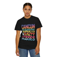 Person wearing a black t-shirt with colorful text 'Cancun Sunsets & Salty Kisses' on a white background
