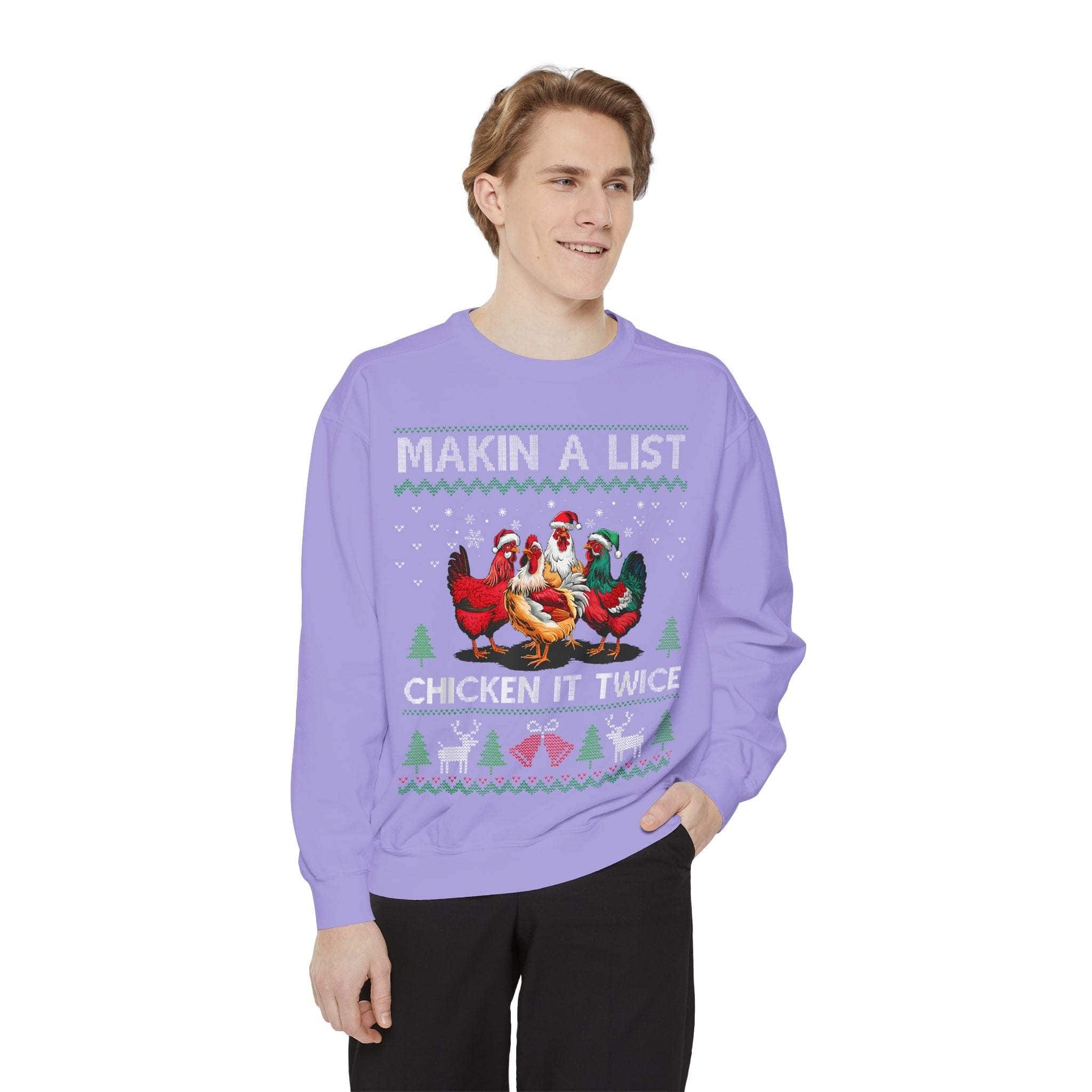 Garment-dyed sweatshirt with Christmas chicken design and text "Making a List, Chicken It Twice" worn by smiling man