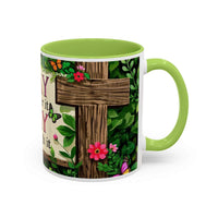 Mug with a cross design, flowers, and butterflies on a white background