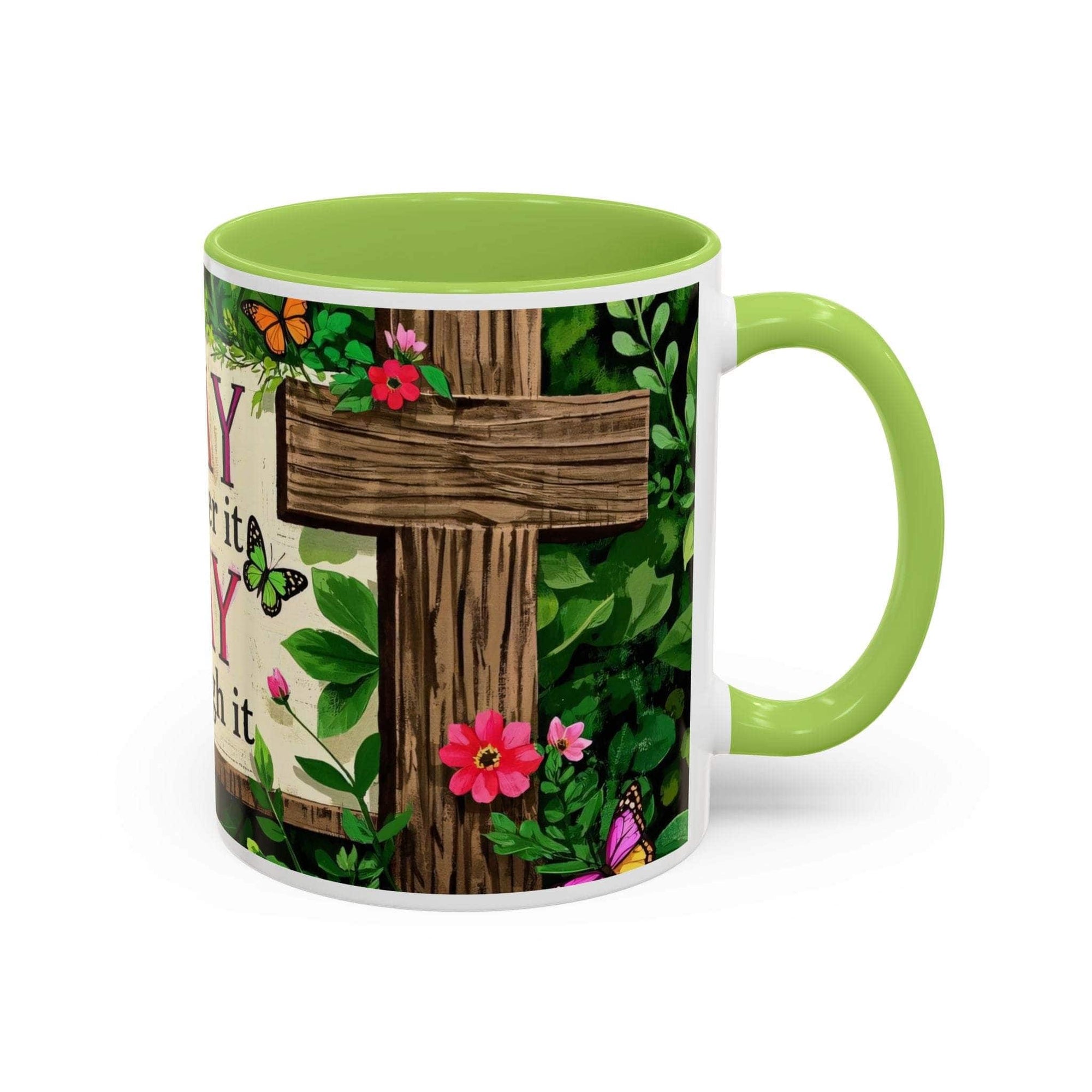 Mug with a cross design, flowers, and butterflies on a white background