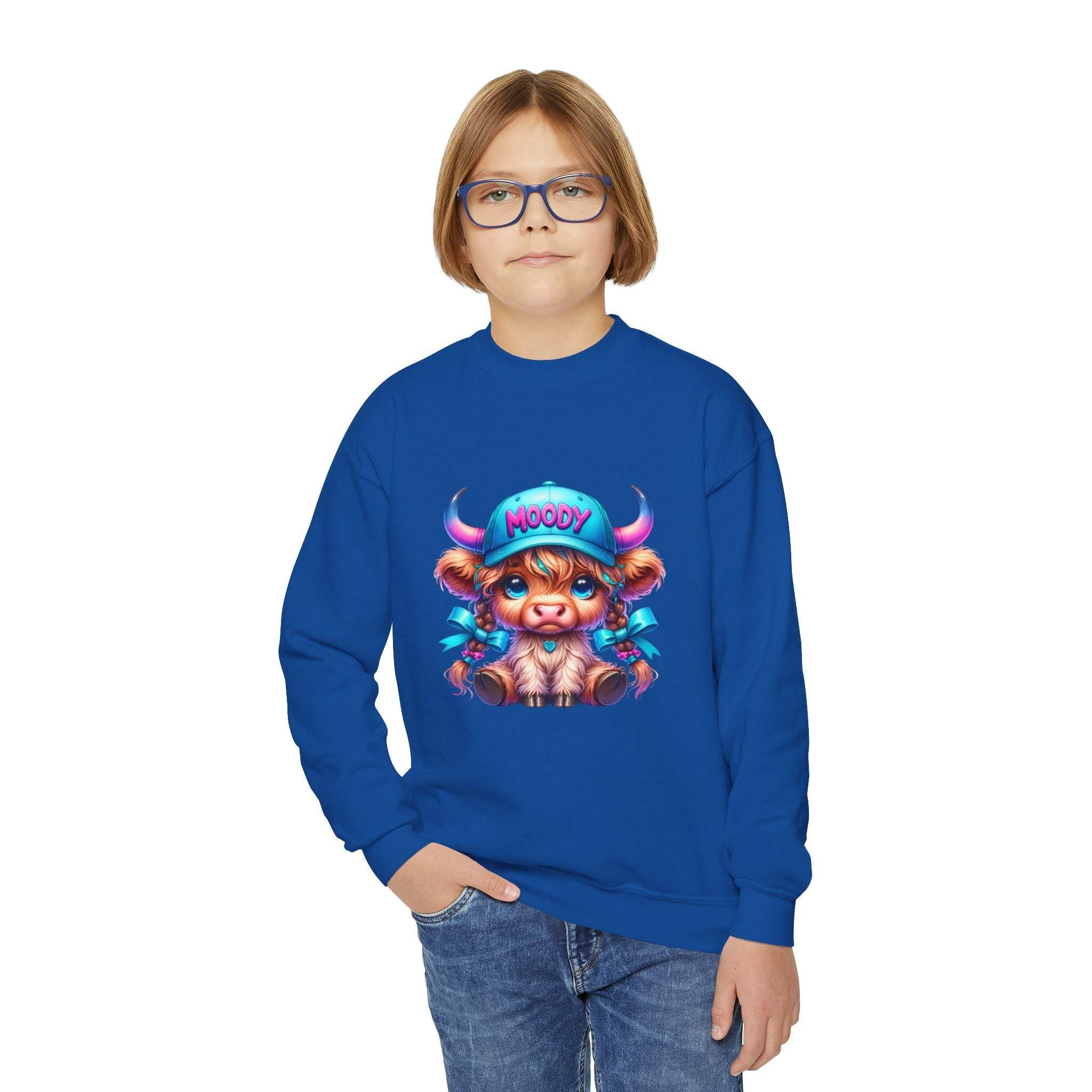Child wearing blue Moody Girl Highland Cow sweatshirt with cartoon cow design