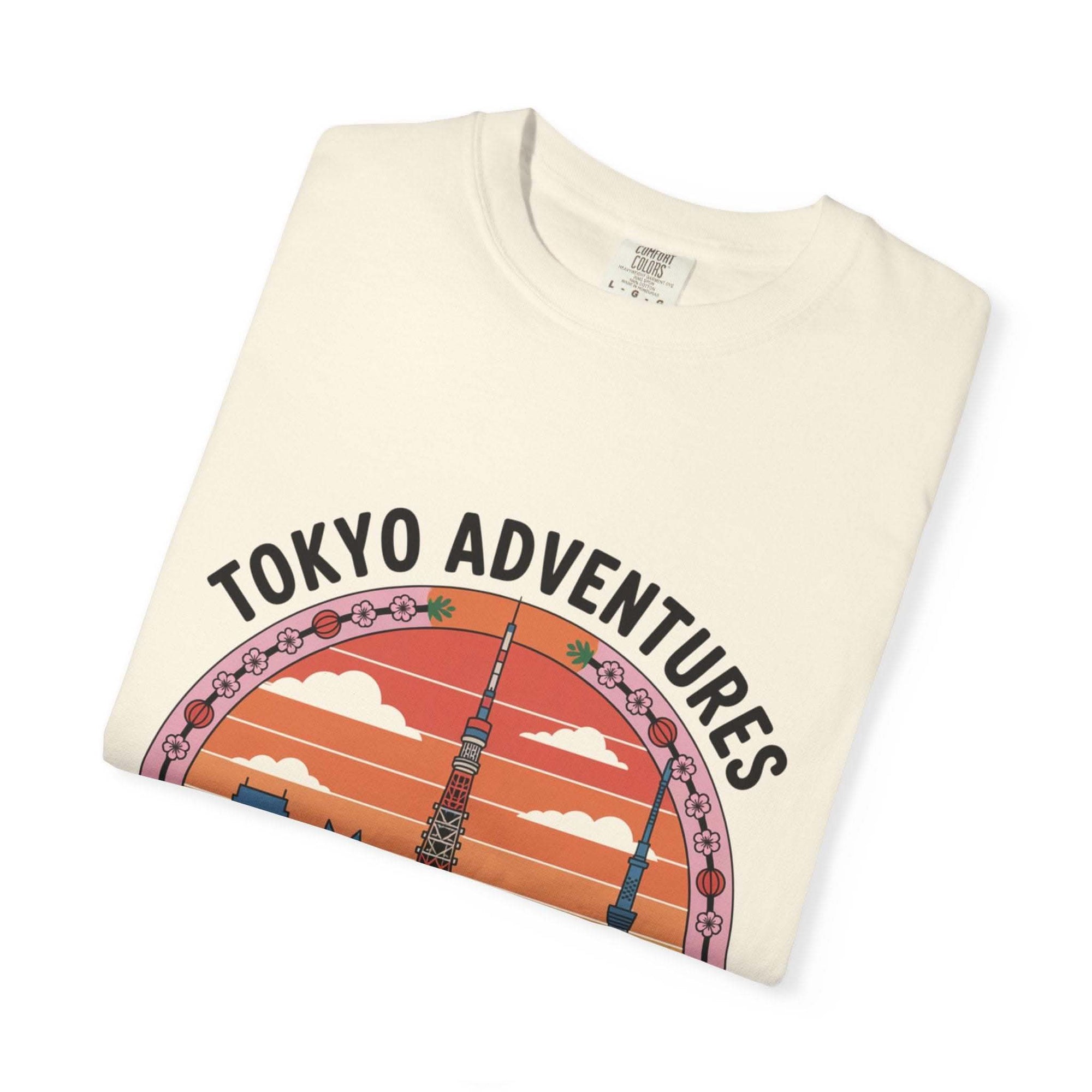 Folded garment-dyed T-shirt with Tokyo Adventures travel graphic and Japanese culture design