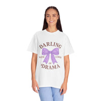 Woman wearing a white t-shirt with a purple bow and text on a white background