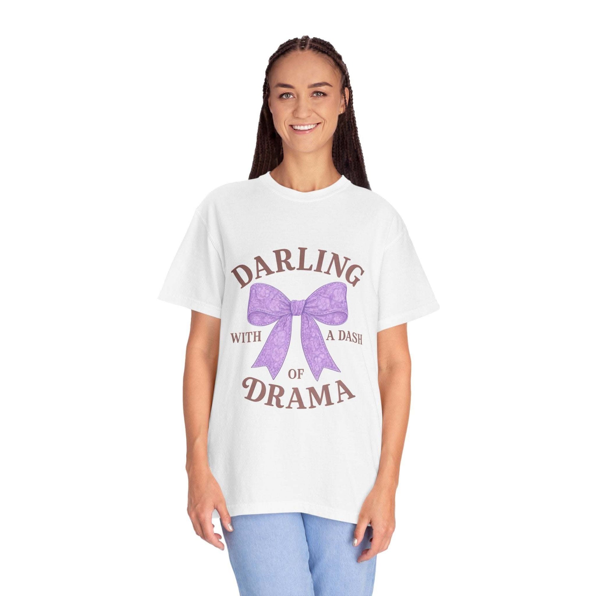 Woman wearing a white t-shirt with a purple bow and text on a white background