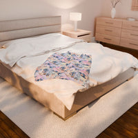 Coastal Cowgirl design plush blanket on bed in cozy modern bedroom setting