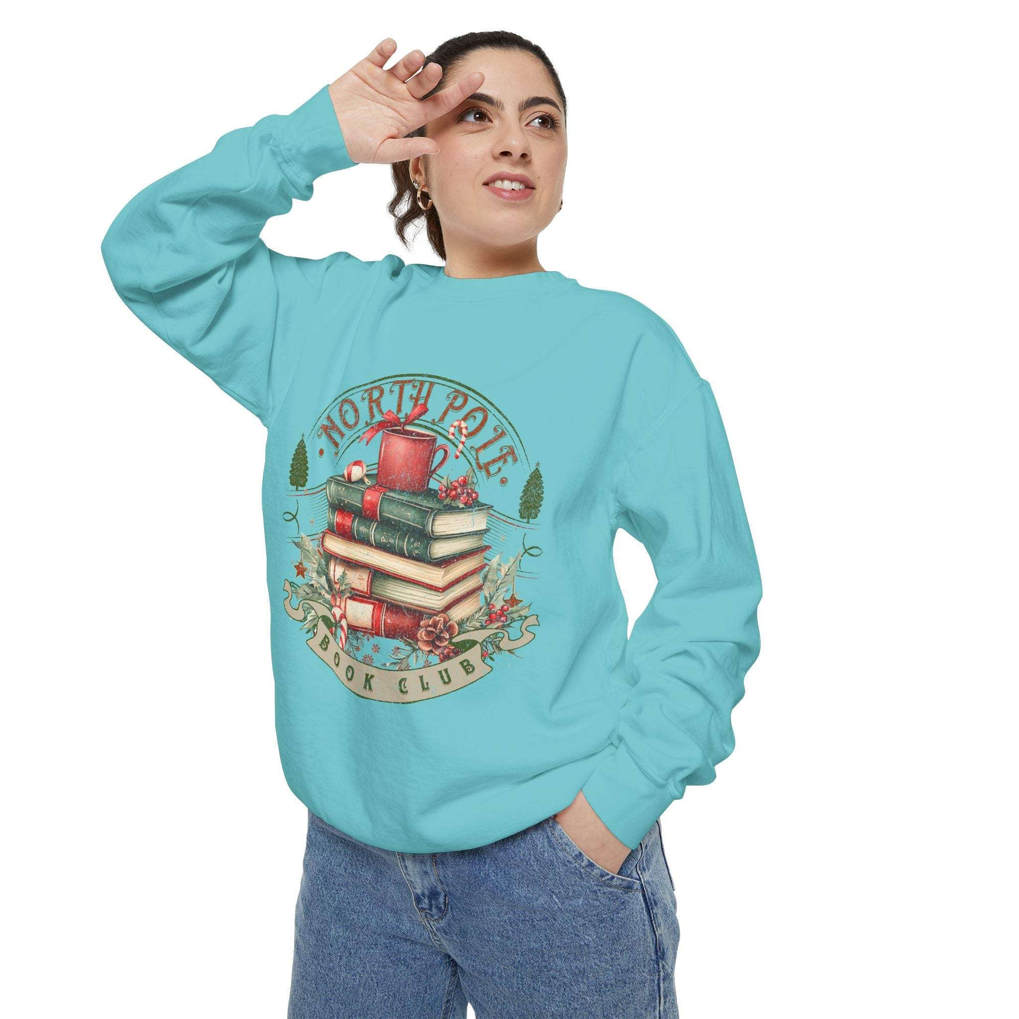 woman wearing blue Vintage North Pole Book Club sweatshirt with holiday book stack design