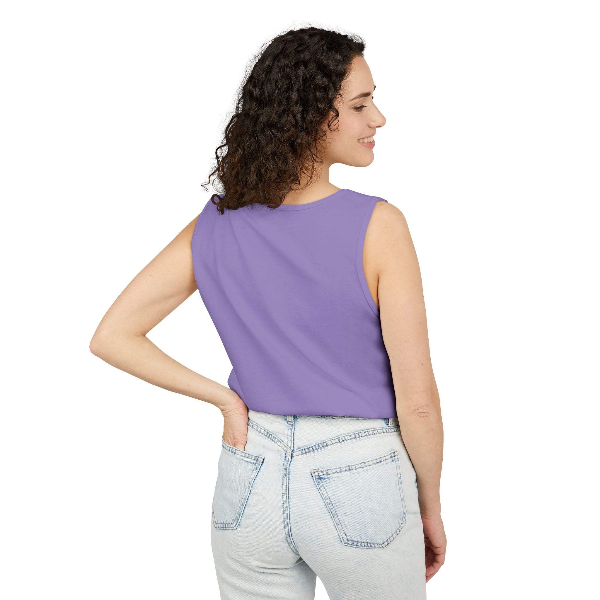 Woman wearing purple sleeveless tank top with relaxed fit and light blue jeans, back view