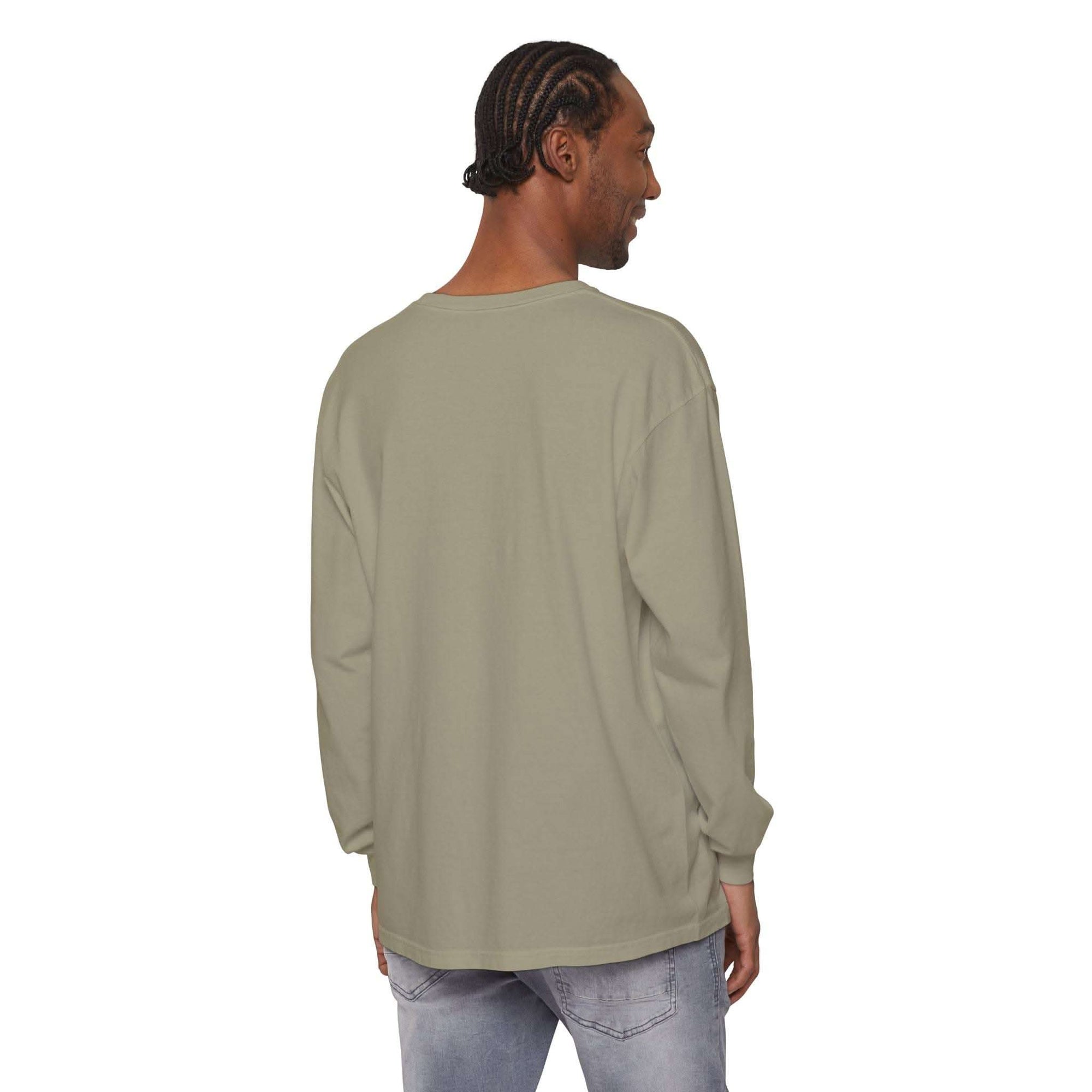 Back view of man wearing plain beige long sleeve t-shirt with ribbed cuffs and relaxed fit
