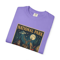 National Park After Dark t-shirt featuring campfire, Sasquatch, Mothman, and night forest creatures in vintage style