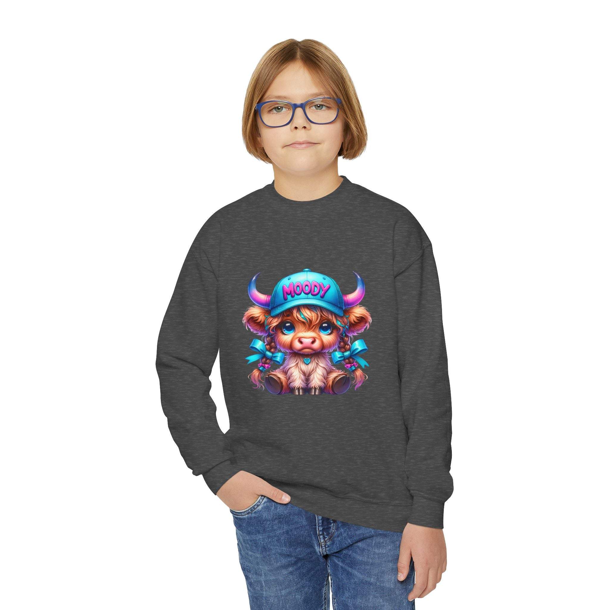Child wearing Moody Girl Highland Cow sweatshirt with colorful cartoon cow design