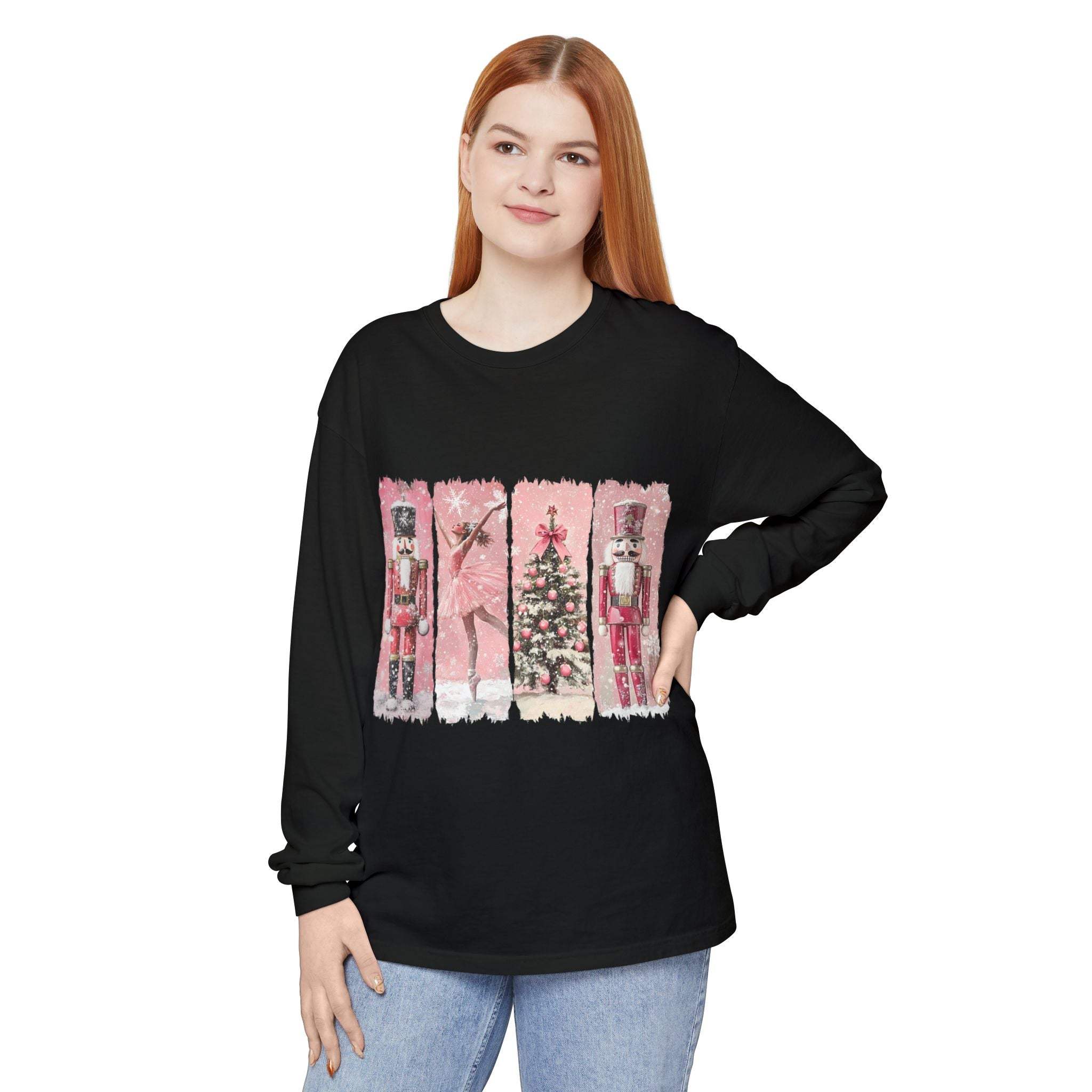 Woman wearing black long sleeve t-shirt with pink watercolor Nutcracker Christmas design