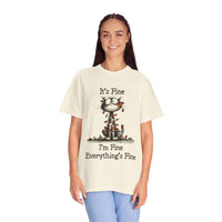 Person wearing a t-shirt with a cat graphic and text on a white background