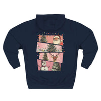 Navy fleece hoodie with Christmas-themed watercolor panels featuring Santa, trees, reindeer, and snowman