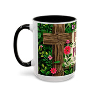 Mug with floral design and cross on a white background