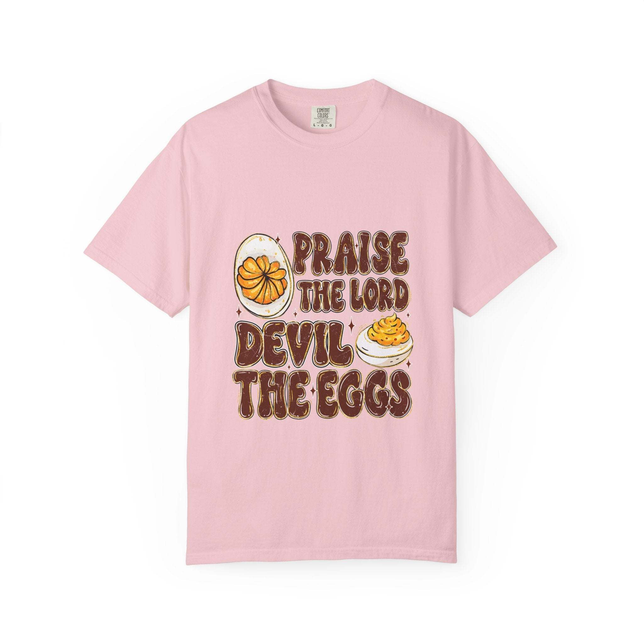 White cotton t-shirt featuring 'Praise the Lord, Devil the Eggs' design, perfect for Easter and Christian apparel.