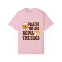 White cotton t-shirt featuring 'Praise the Lord, Devil the Eggs' design, perfect for Easter and Christian apparel.