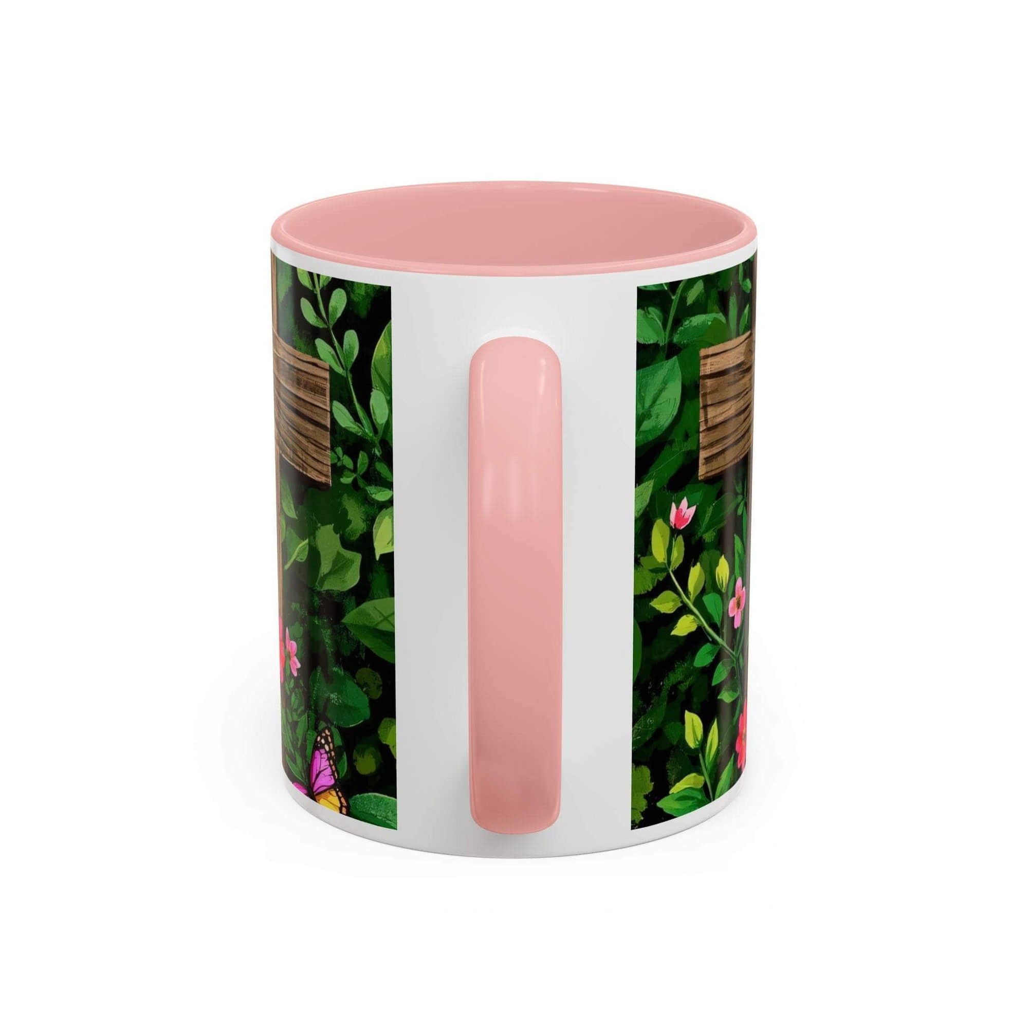 Mug with pink interior and handle, featuring a floral pattern on a white background