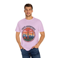 Garment-dyed Tokyo Adventures travel t-shirt with graphic print worn by smiling man