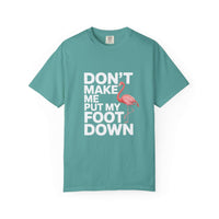 Dont Make Me Put My Foot Down flamingo t-shirt with humorous pink flamingo graphic and bold white text on vintage garment-dyed cotton