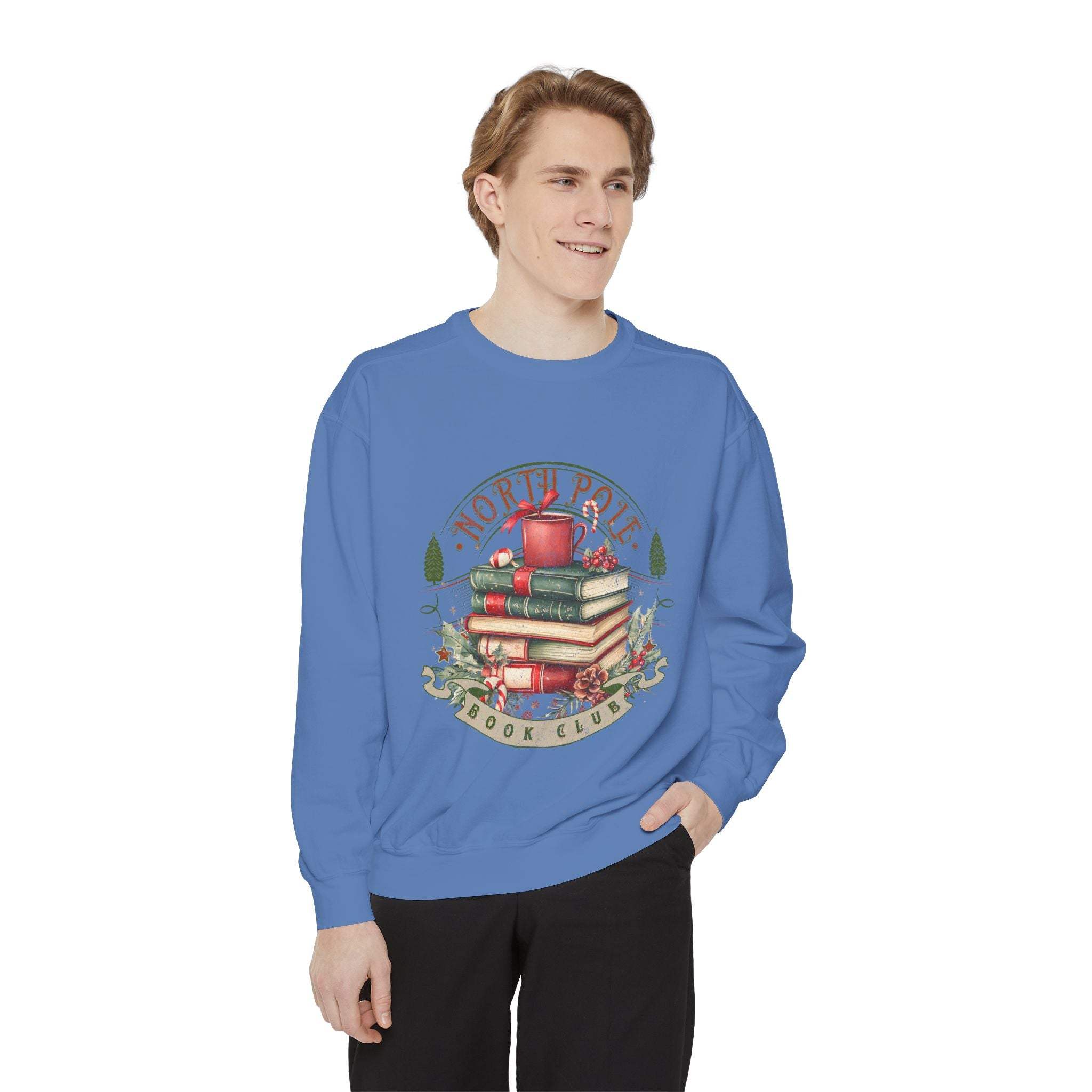 Man wearing blue Vintage North Pole Book Club sweatshirt with festive book stack design