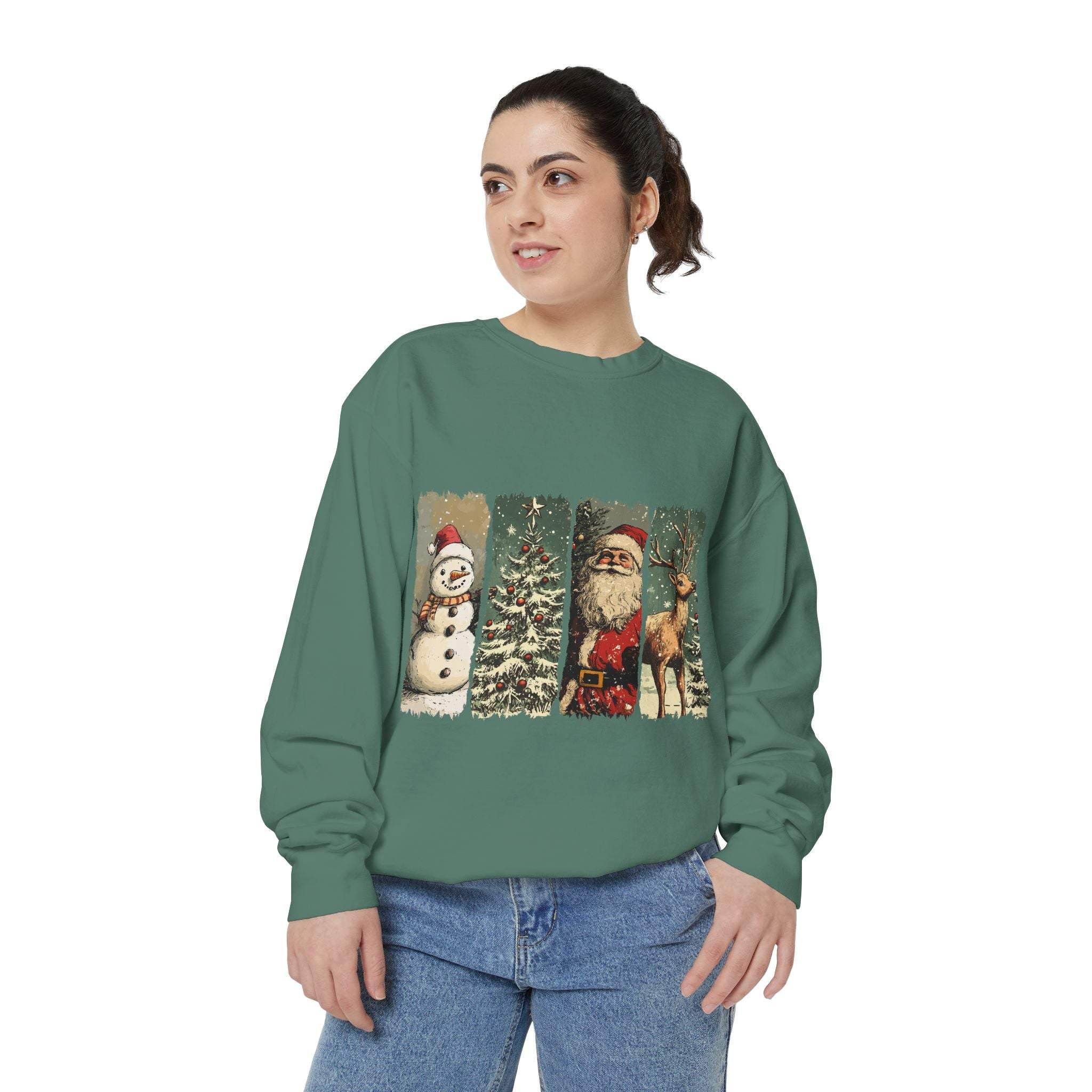 Vintage Christmas sweatshirt with watercolor holiday swatches featuring snowman, tree, Santa, and reindeer designs on green fabric