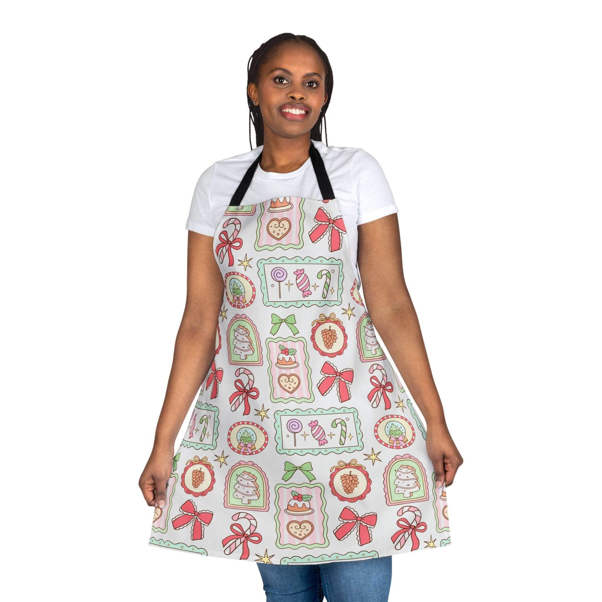 Woman wearing a Retro Christmas Frames apron with festive holiday designs and black straps