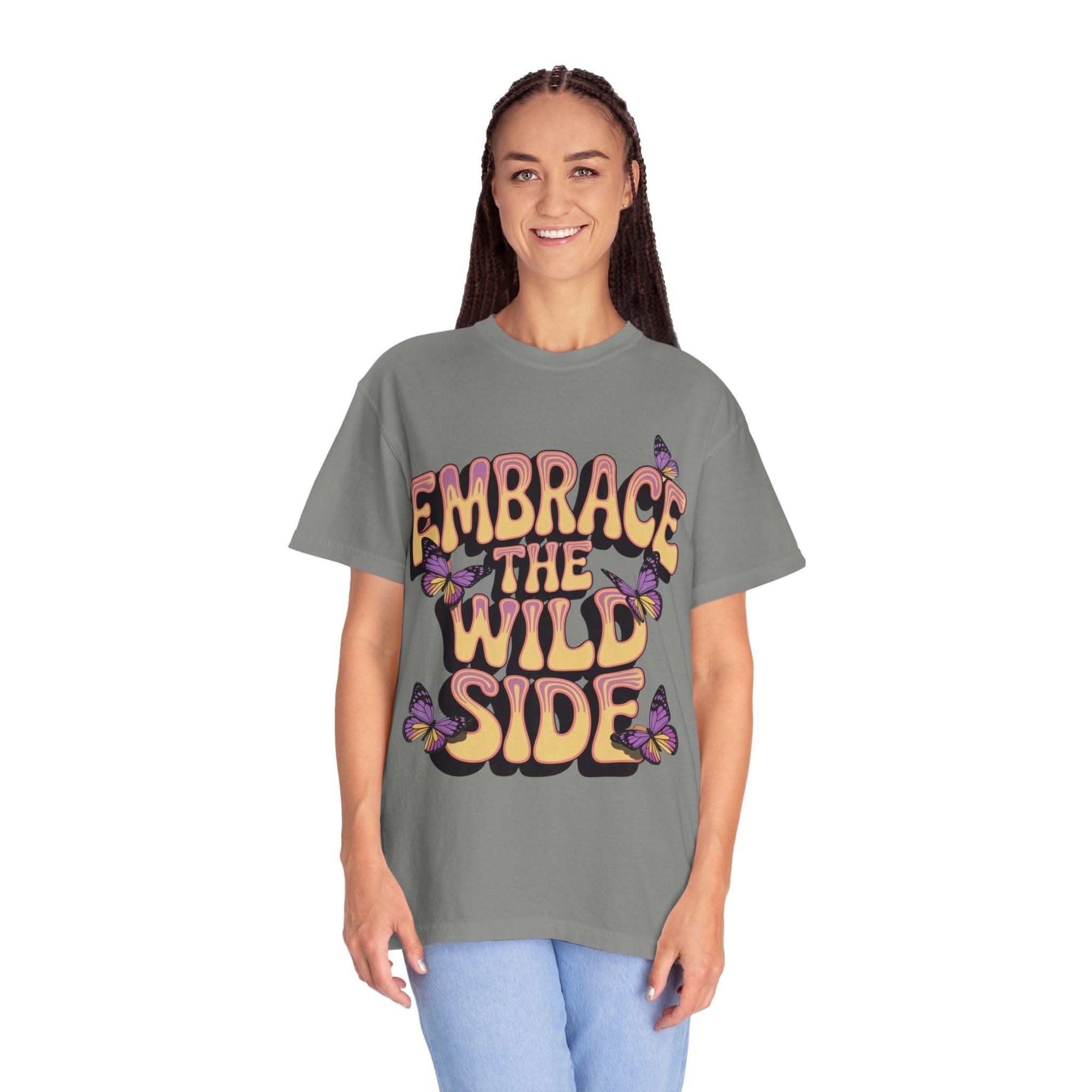 Unisex garment-dyed T-shirt with "Embrace the Wild Side" print and butterfly design on soft gray cotton fabric