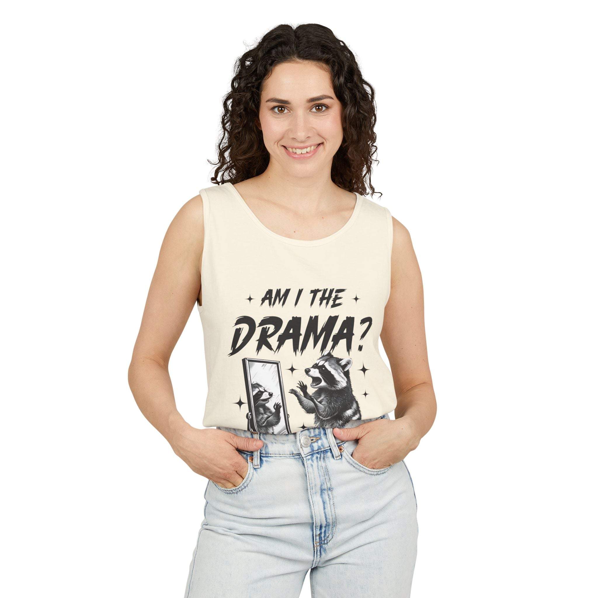 Woman wearing a casual cream tank top with "Am I The Drama?" graphic design and light blue jeans