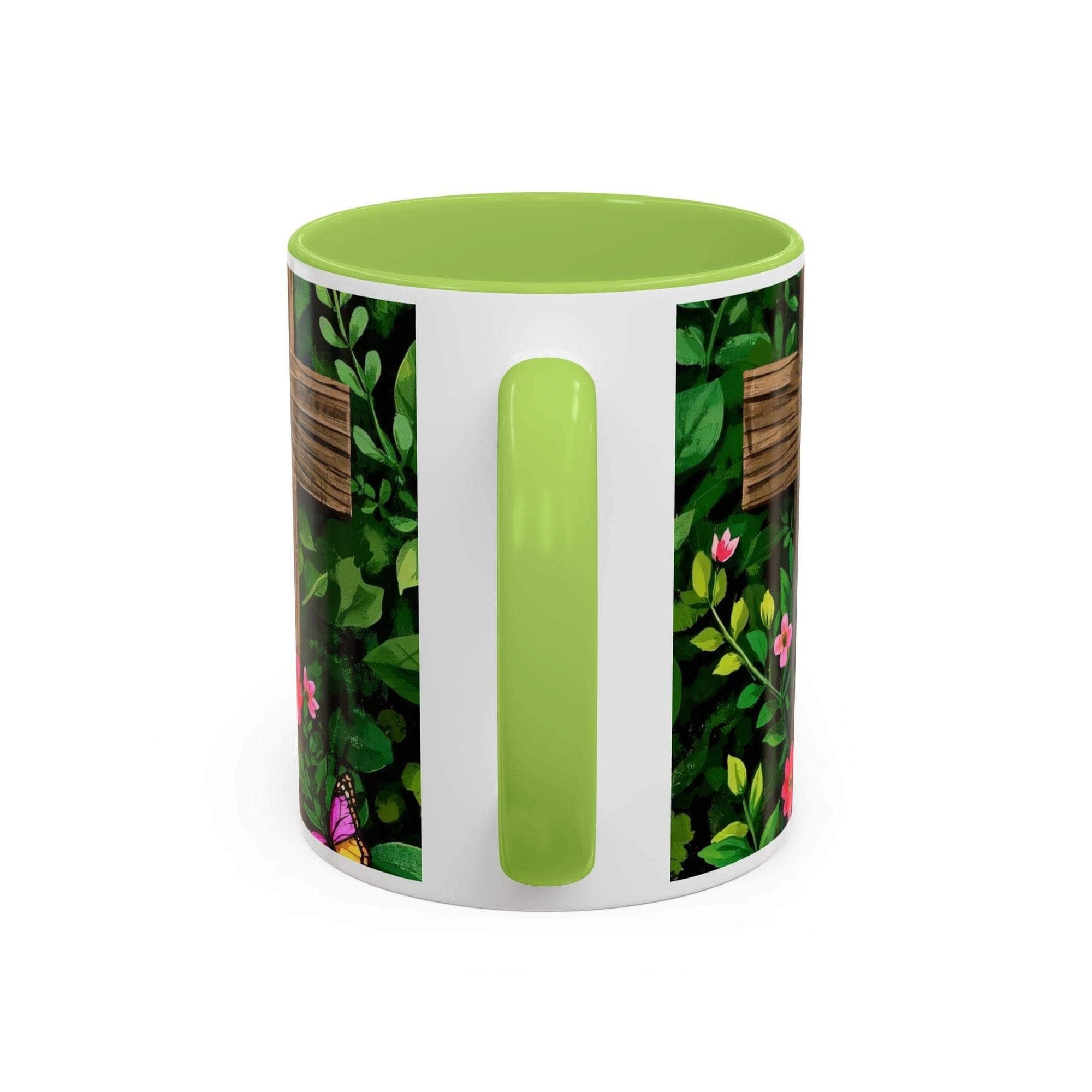 Mug with green lid and handle, featuring a floral pattern on a white background