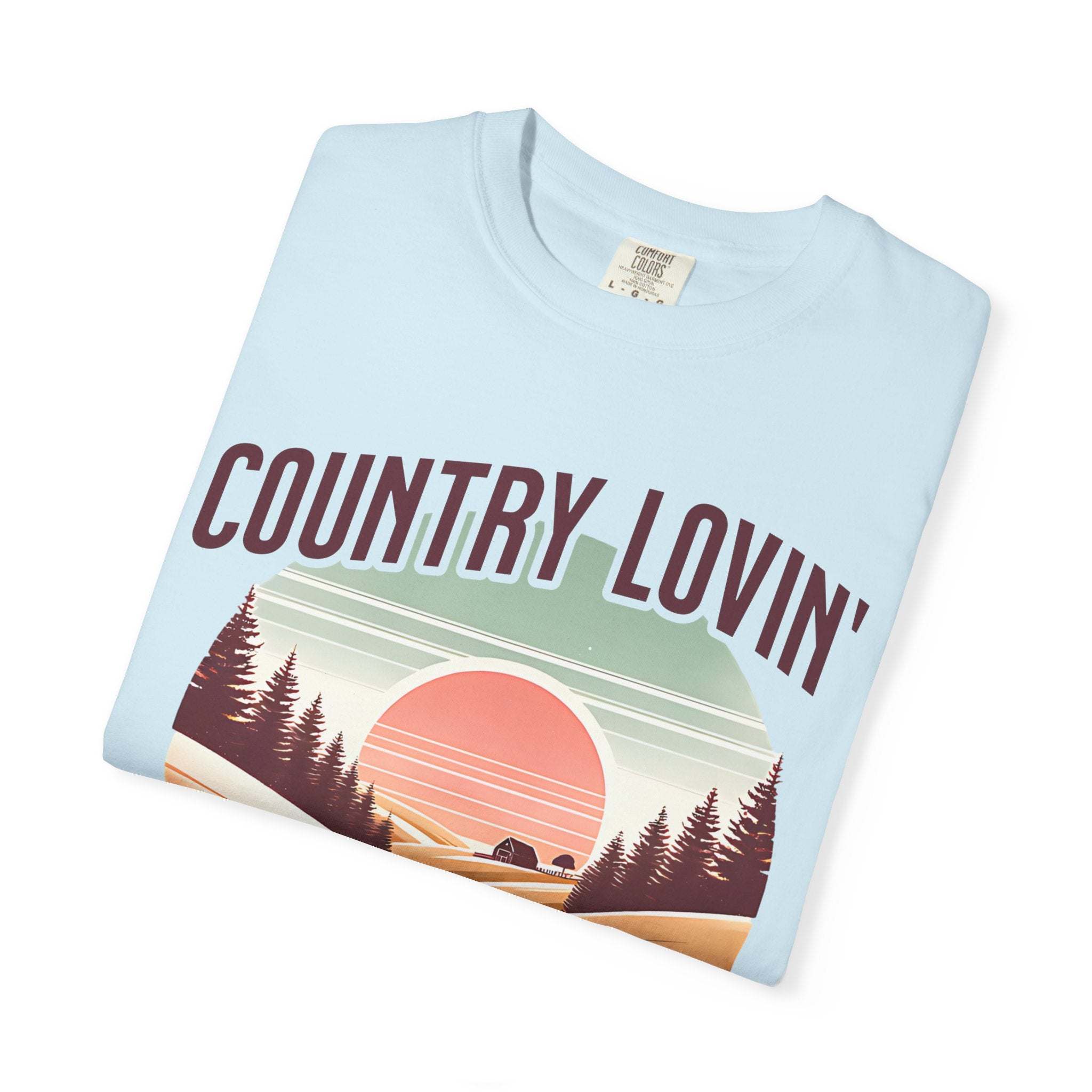 Country Lovin Girl T-shirt with vintage sunset and forest design on light blue cotton fabric