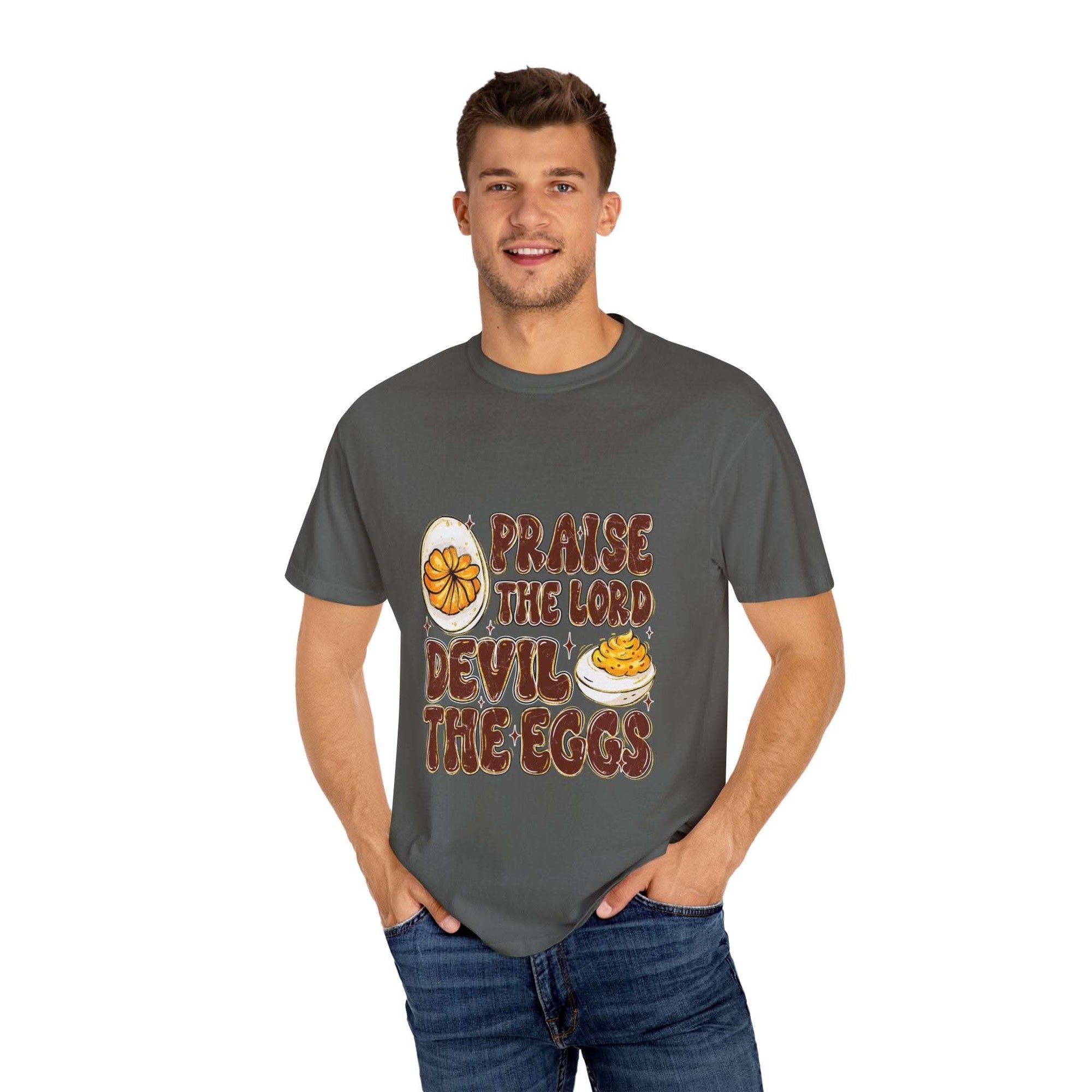 White cotton t-shirt featuring 'Praise the Lord, Devil the Eggs' design, perfect for Easter and Christian apparel.