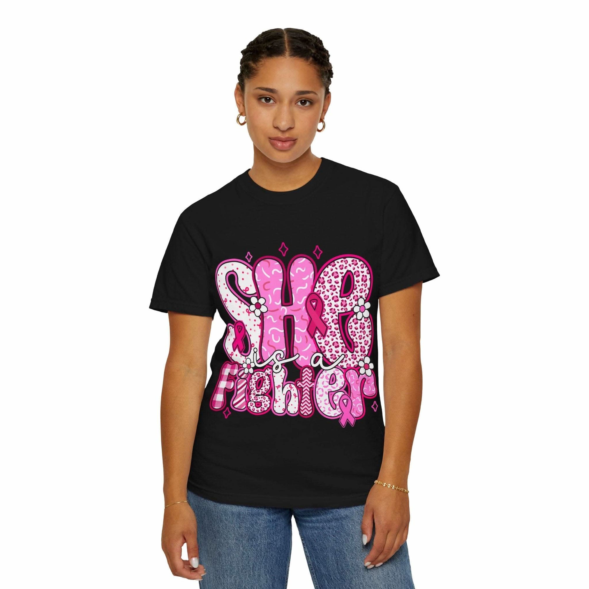 Woman wearing black Fighter Breast Cancer T-shirt with pink graphic design and relaxed fit
