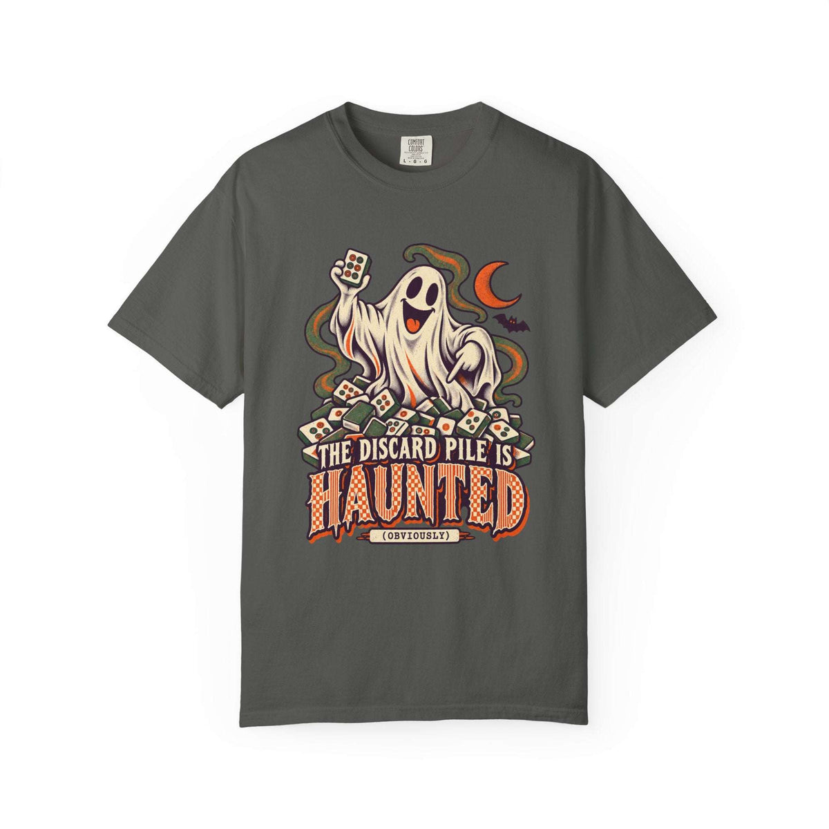 Pepper Comfort Colors 1717 Halloween mahjong T-shirt with a ghost holding a tile and “The Discard Pile Is Haunted (Obviously)” lettering.