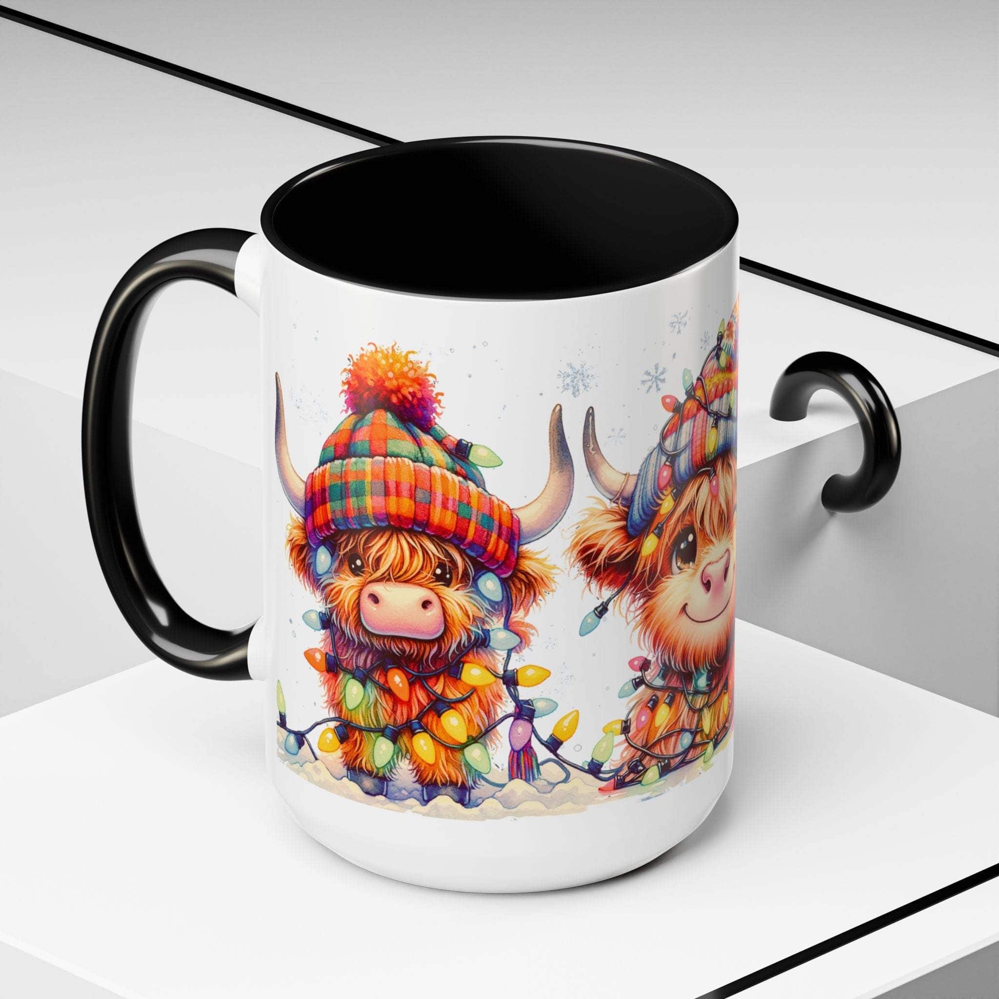 Ceramic Christmas coffee mug with festive Scottish Highland cow illustration and black handle and interior