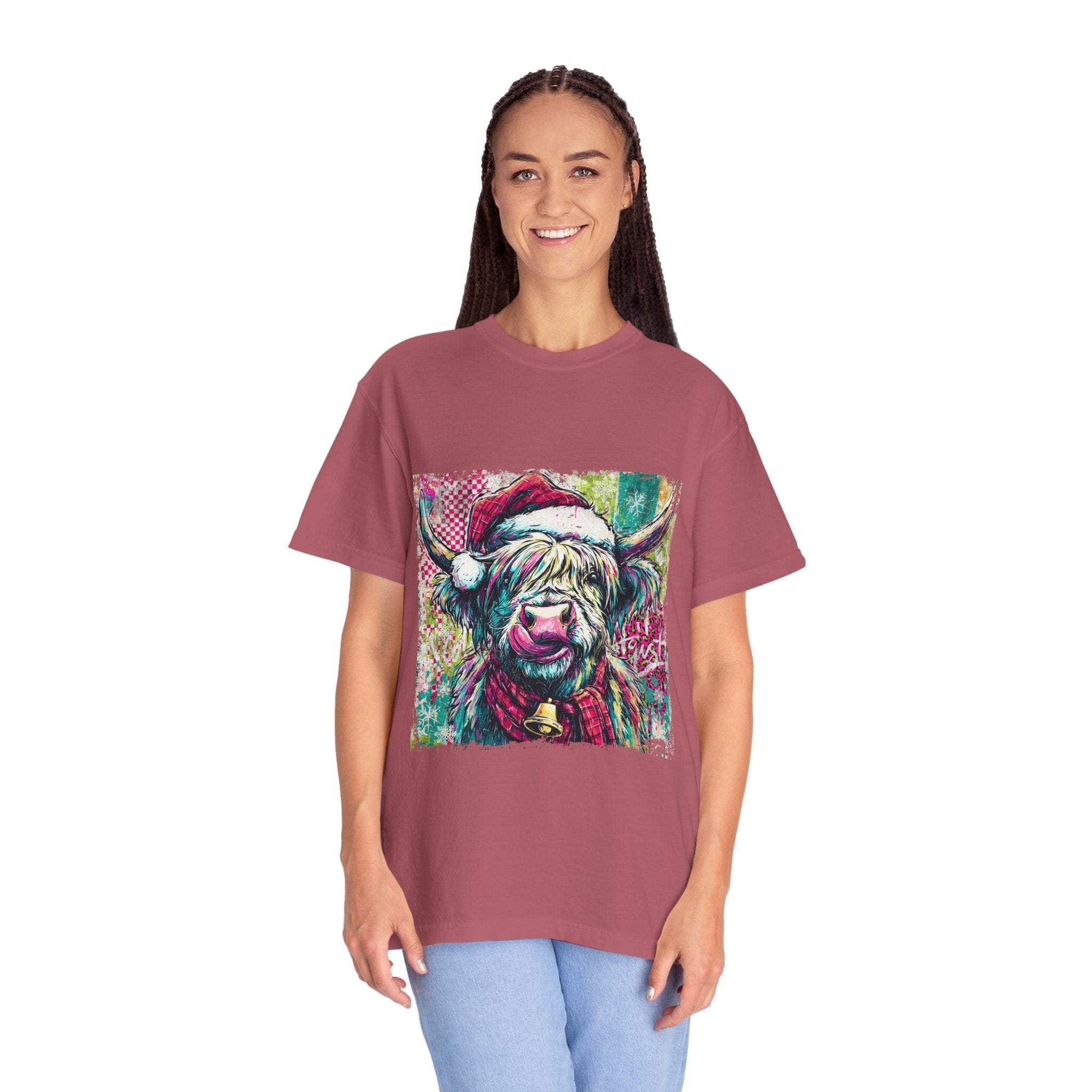 Woman wearing Retro Santa Highland Cow T-shirt with festive graphic design