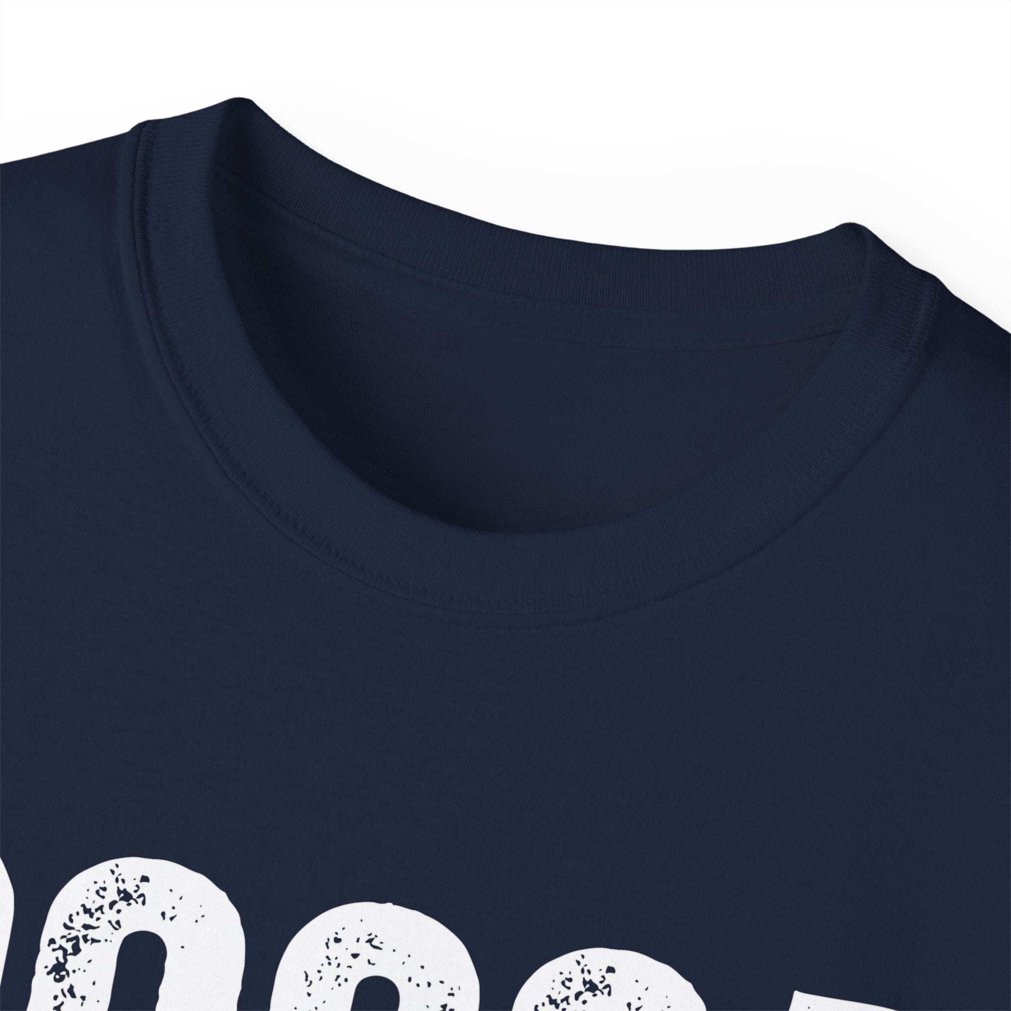 Close-up of Distressed Cocoa Cutie Tee in navy blue with vintage white lettering