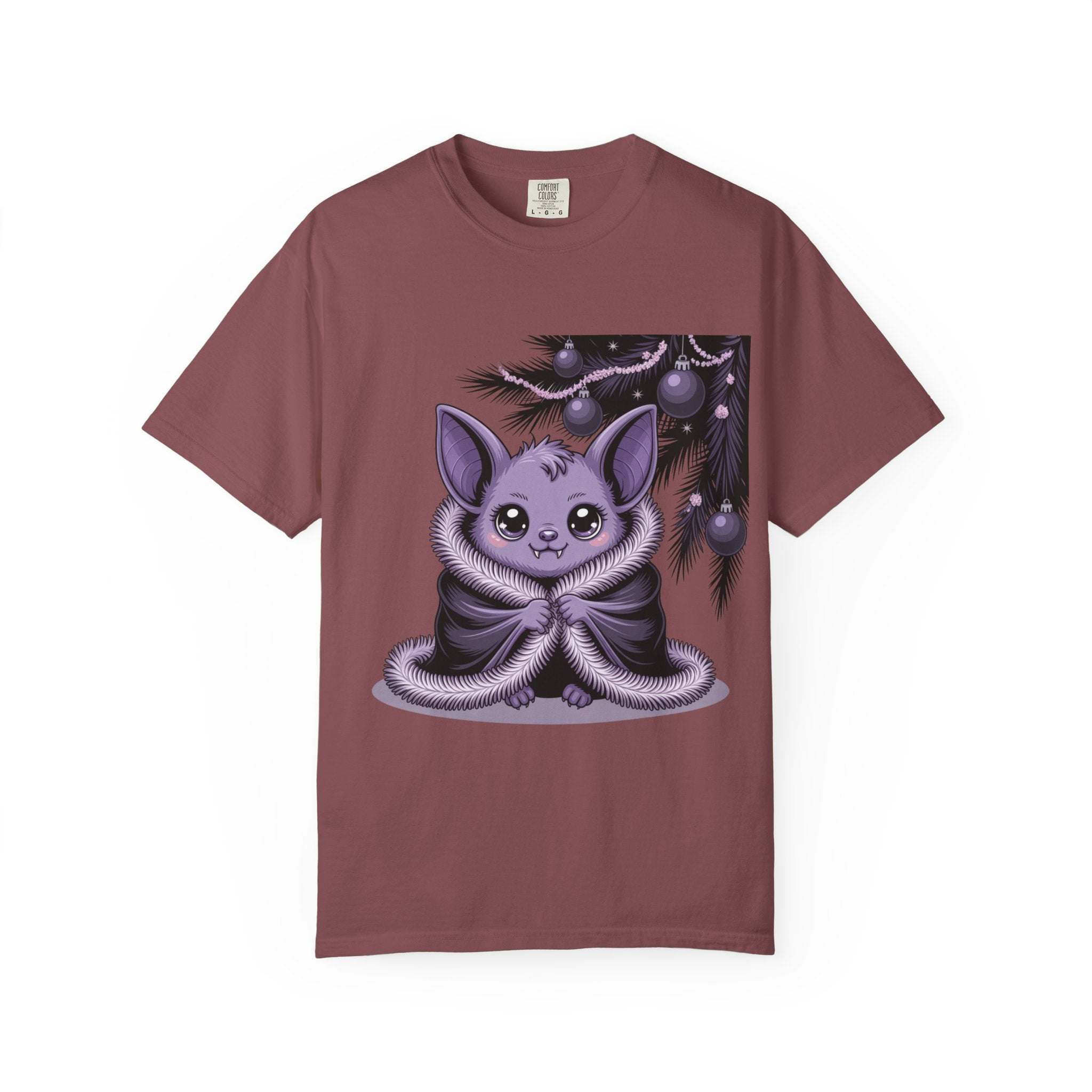 Maroon t-shirt with a cute purple creature graphic on a white background